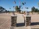 Community fountain with flags and palm trees at 625 S Desert Flower Dr, Mesa, AZ 85208