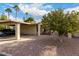 Front yard with an orange tree and a carport at 625 S Desert Flower Dr, Mesa, AZ 85208