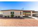 Ranch-style home with carport and landscaped yard at 723 S Pima St, Mesa, AZ 85210