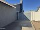 Private backyard with gray gate and concrete patio at 7406 W Colter St, Glendale, AZ 85303