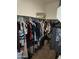 Walk-in closet with ample hanging space and shelving for storage at 8506 S 256Th Dr, Buckeye, AZ 85326