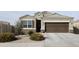 Charming single-story home with a two-car garage and landscaped front yard at 8506 S 256Th Dr, Buckeye, AZ 85326