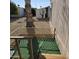 Small backyard with artificial turf, a palm tree, and a wooden fence at 11596 W Sierra Dawn Blvd # 156, Surprise, AZ 85378