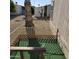A fenced backyard featuring artificial turf, a palm tree, and desert landscaping at 11596 W Sierra Dawn Blvd # 156, Surprise, AZ 85378