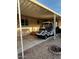Covered carport with a golf cart parked underneath at 11596 W Sierra Dawn Blvd # 156, Surprise, AZ 85378