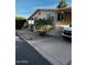 Front exterior view of a single-story home with landscaping and holiday decor at 11596 W Sierra Dawn Blvd # 156, Surprise, AZ 85378