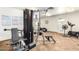Fitness room with weight machines, exercise bikes, and instructional posters at 11596 W Sierra Dawn Blvd # 156, Surprise, AZ 85378