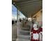Covered porch with stairs, holiday decorations, and gravel landscaping at 11596 W Sierra Dawn Blvd # 156, Surprise, AZ 85378