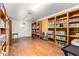 Community library with bookshelves, reading chairs, and an exit door at 11596 W Sierra Dawn Blvd # 156, Surprise, AZ 85378