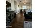 Open-concept living and dining area with wood floors and comfortable furniture at 11596 W Sierra Dawn Blvd # 156, Surprise, AZ 85378