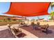 Covered patio with seating near the community pool at 11596 W Sierra Dawn Blvd # 156, Surprise, AZ 85378