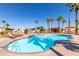 Community pool with lounge chairs, umbrellas, and a cabana at 11596 W Sierra Dawn Blvd # 156, Surprise, AZ 85378