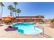 Inviting community pool with steps, handrails, and lounge chairs at 11596 W Sierra Dawn Blvd # 156, Surprise, AZ 85378