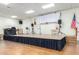 Elevated stage area in clubhouse with sound equipment and American flag at 11596 W Sierra Dawn Blvd # 156, Surprise, AZ 85378