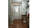 Utility room with a back door, storage cabinets, and cleaning supplies at 11596 W Sierra Dawn Blvd # 156, Surprise, AZ 85378