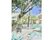 Community pool with lounge chairs, palm trees, and a spa at 1295 N Ash St # 114, Gilbert, AZ 85233