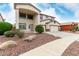 Home's front exterior with landscaping and a walkway at 15835 W Desert Mirage Dr, Surprise, AZ 85379