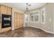 Kitchen features wood cabinets, a double oven, pantry, and tile flooring at 15835 W Desert Mirage Dr, Surprise, AZ 85379