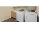 Laundry room with washer, dryer, utility sink, and cabinets at 15835 W Desert Mirage Dr, Surprise, AZ 85379