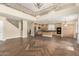 Open concept living room and kitchen area with wood-look tile floors at 15835 W Desert Mirage Dr, Surprise, AZ 85379