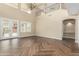 Spacious living room with tile floors, and access to backyard at 15835 W Desert Mirage Dr, Surprise, AZ 85379