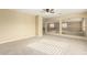 Bright and spacious loft with plush carpeting and ceiling fan at 15835 W Desert Mirage Dr, Surprise, AZ 85379