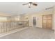 Loft area with carpeted floors, built-in closet, and access to another room at 15835 W Desert Mirage Dr, Surprise, AZ 85379