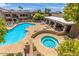 Inviting community pool with a hot tub, lounge chairs, and covered seating area at 1720 E Thunderbird Rd # 2055, Phoenix, AZ 85022