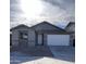 New single-story home with a two-car garage and modern gray exterior at 17499 W Lupine Ave, Goodyear, AZ 85338