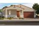 Charming single-story home with a two-car garage and inviting entryway at 17731 W Elm St, Goodyear, AZ 85395