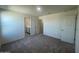 Bedroom with gray carpet, white walls, and an ensuite bathroom at 1937 E Parr Fame Ln, San Tan Valley, AZ 85140