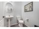 Small bathroom with pedestal sink and toilet at 20171 N Bustos Way, Maricopa, AZ 85138