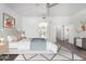 Main bedroom with king bed and access to bathroom at 20171 N Bustos Way, Maricopa, AZ 85138