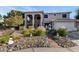 Two-story house with landscaped front yard and a three-car garage at 20171 N Bustos Way, Maricopa, AZ 85138
