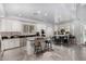 Modern kitchen with granite island, stainless steel appliances, and white cabinets at 20171 N Bustos Way, Maricopa, AZ 85138