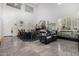 Spacious living room with high ceilings, fireplace, and large windows at 20171 N Bustos Way, Maricopa, AZ 85138