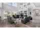 Open living room with high ceilings, fireplace, and access to backyard pool at 20171 N Bustos Way, Maricopa, AZ 85138