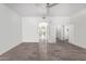 Bright living room with tile floors and access to other rooms at 20171 N Bustos Way, Maricopa, AZ 85138
