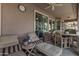 Covered patio with seating and outdoor fan at 20171 N Bustos Way, Maricopa, AZ 85138