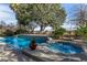 Relaxing backyard oasis with inviting pool, spa, and ample seating at 20171 N Bustos Way, Maricopa, AZ 85138