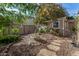 Landscaped side yard with storage shed and pathway at 20171 N Bustos Way, Maricopa, AZ 85138