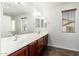 Double sink vanity and tile flooring in a well-lit bathroom at 26662 N Babbling Brook Dr, Phoenix, AZ 85083