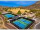 Community tennis and pickleball courts with shaded viewing area and playground at 26662 N Babbling Brook Dr, Phoenix, AZ 85083