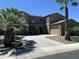 Inviting two-story home with palm trees, a paved driveway, and a three-car garage at 3333 E Powell Pl, Chandler, AZ 85249