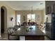 Kitchen with island, granite countertops, dining area, and stainless steel appliances at 3333 E Powell Pl, Chandler, AZ 85249