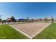 Sand volleyball court with net and surrounding grass at 3733 S Ponderosa Dr, Gilbert, AZ 85297