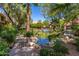 Landscaped grounds with a pond, bridge, and community pool at 5122 E Shea Blvd # 1094, Scottsdale, AZ 85254