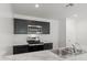 Kitchen with dark cabinets, stainless steel appliances, and a white and gray marble countertop at 5439 E Rock Bush Ln, San Tan Valley, AZ 85140