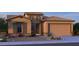 Charming two-story home with a tile roof, stone accents, and a two-car garage at 5863 S Romano --, Mesa, AZ 85212