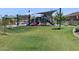 Elevated view of the community park including playground, ramada, and grassy area at 8652 W Warner St, Tolleson, AZ 85353